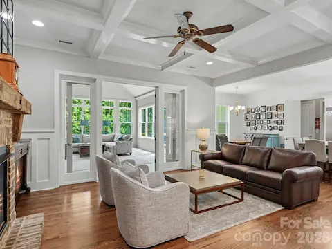 Great room with french doors leading to huge sunroom