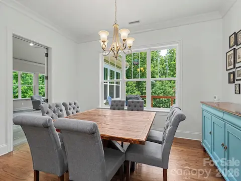 Breakfast area leads to deck and overlooks  huge fenced backyard