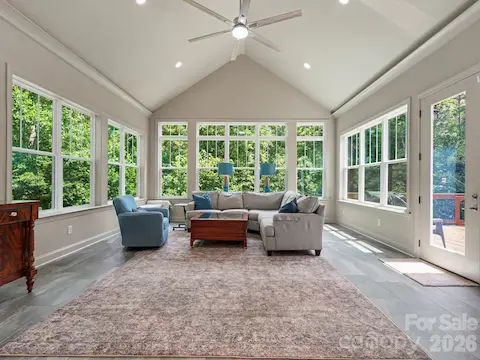 Amazing sunroom vaulted ceiling and leads to private deck