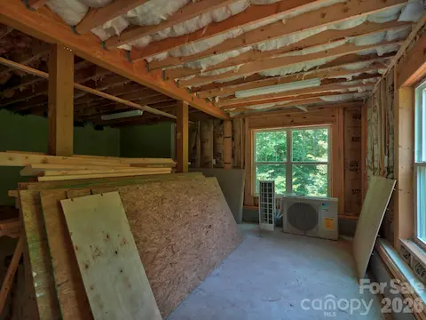 Partially finished basement room for workshop or private office