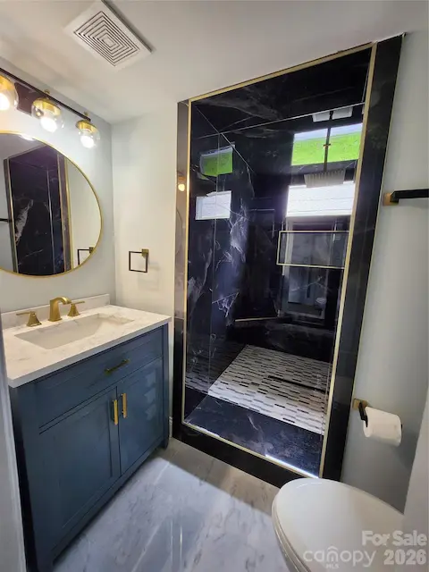 Downstairs full bath with oversized luxurious  shower cave