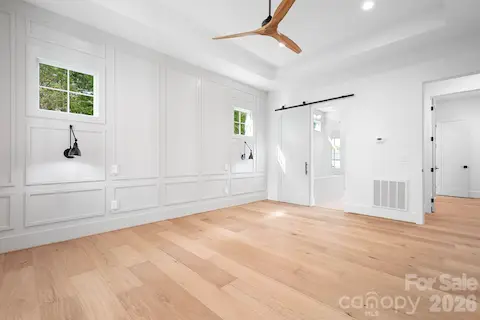 Barn door to Primary ensuite bath