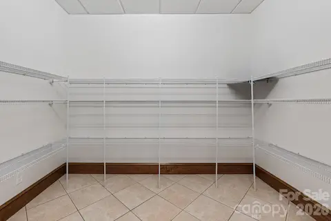 Primary bedroom walk-in closet
