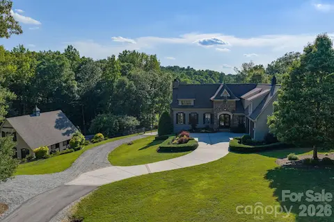 Situated on a gated 11.6 private acres