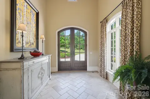 Designed by Jim Phelps and built by Arcadia Homes, Foyer w/cathedral tongue & groove ceiling