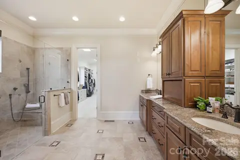 Heated bathroom floors, custom cabinets, frameless glass and tile 9'7"x3'8" shower w/bench & stained glass accent window