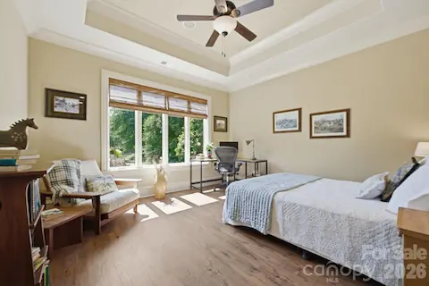 Lower level guest suites, both with access to covered paver patio
