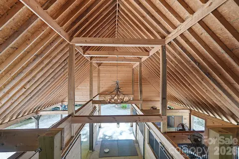 Antler chandelier, stalls have exterior dutch doors, mats and fans