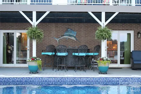 One of many seating areas.  Room for 25+ to set around the pool just above the lake.