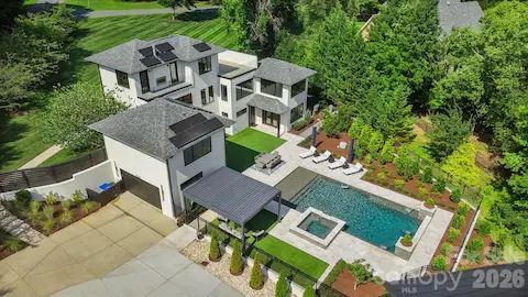 Aerial view of rear designer pool, spa, and outdoor entertaining area