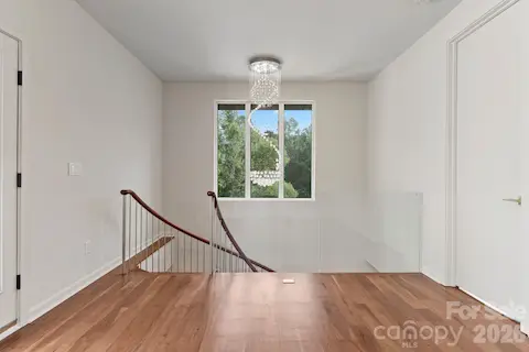 Second-floor loft/bonus room with private access to the rooftop terrace
