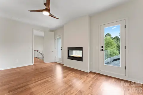 Second-floor guest suite with private patio, gas fireplace, and full en-suite bathroom