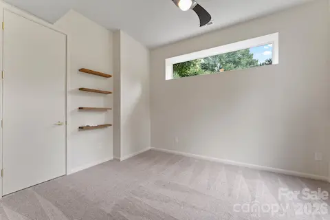 Ground-floor guest bedroom with natural light
