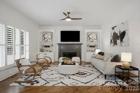 The Living Room with a gas-starter wood-burning fireplace