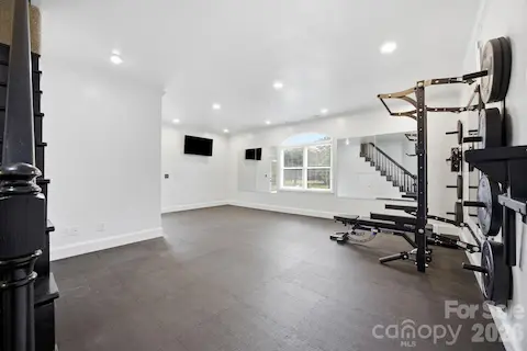 Gym. Or family room or bedroom. There is a  separate entrance with a bath. Gym equipment has now been removed.