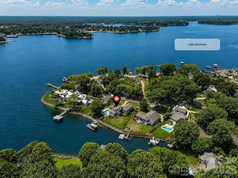 Exceptional Lake Norman waterfront setting with expansive main channel views, a private dock, and an ideal location for enjoying the best of lakefront living. (Virtually enhanced lake levels)