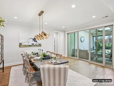 The Dining opens to the covered outdoor space with doors