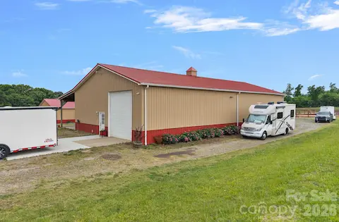 Three oversized garage doors and drive around for ease of maneuvering large vehicles and trailers.