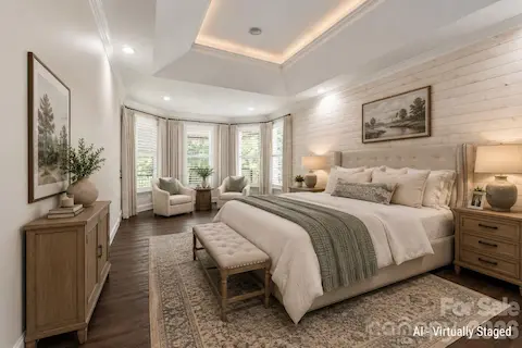 Primary Bedroom with Seating Area - virtually staged