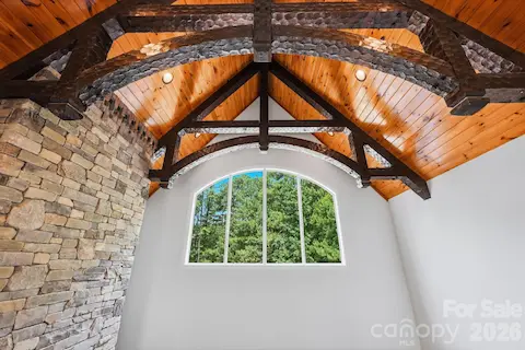 Stunning Great Room Ceiling with Hand-Hewn Beams