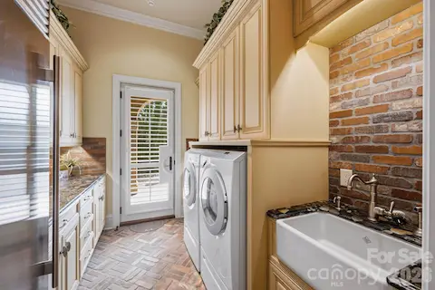 Main- level laundry with access to the motor court.