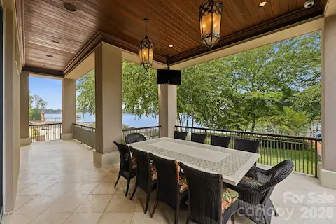 Upper-Level Terrace with heated floors, tv, and lake views.