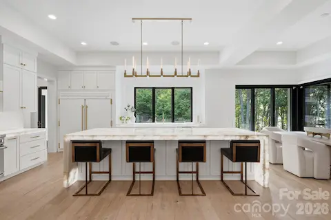 Illuminating Crystalita countertops, designer lighting is perfect for entertaining.