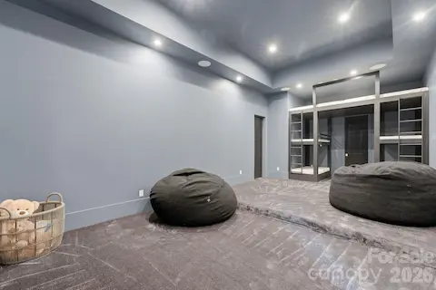 Theatre room that is prewired for a projector. How cool are the built-in bunk beds?