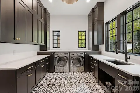 Main level laundry room and drop zone.