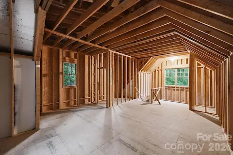 Unfinished space above the detached garage that is prewired and preplummed.