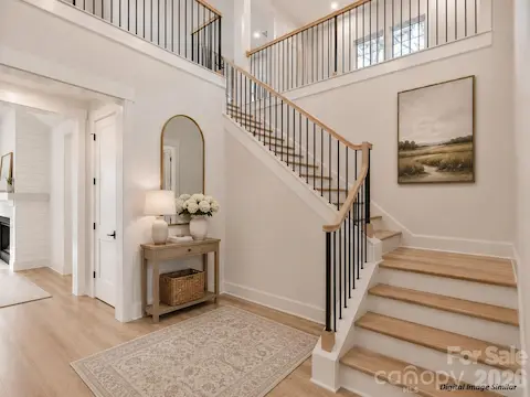 Grand two story foyer greeting you upon entry