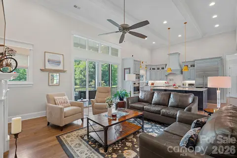 View of open floor plan from living area.  Extends to covered screened in porch!