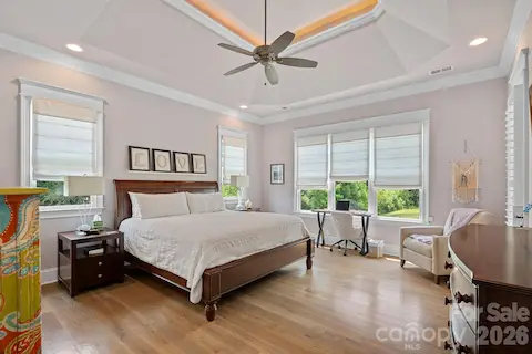 Primary bedroom/main floor - beautiful moldings and tray ceiling.