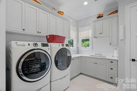Expansive laundry room with sink and lots of storage