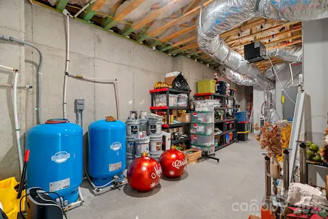 Very nice storage areas/ water softener tanks/two 50 gallon hot water tanks.