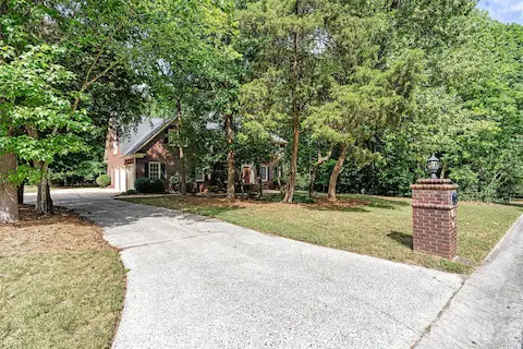 Classic architecture, mature landscaping & a nearly half-acre homesite create exceptional curb appeal.