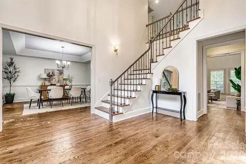 Gorgeous wood-tread staircase with elegant landing.