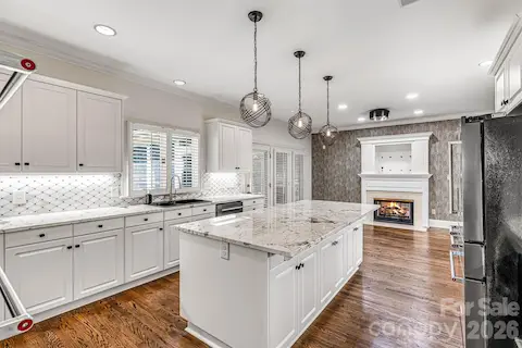 Refinished hardwoods, crisp white cabinetry & under-cabinet lighting.