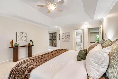 Primary suite features an ensuite bath & built-in glass display cabinet.