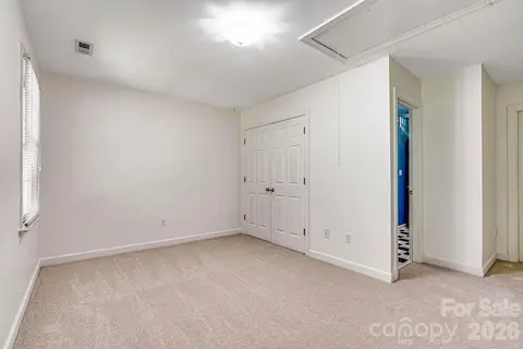 One of two spacious secondary bedrooms designed with comfort in mind.