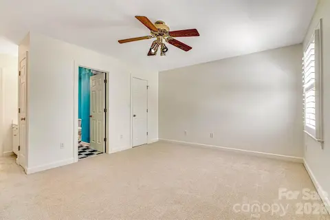 Two spacious upper-level bedrooms share a convenient Jack-and-Jill bath.
