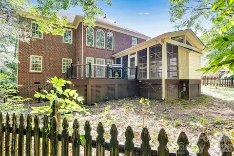 Fenced backyard on a nearly half-acre homesite.