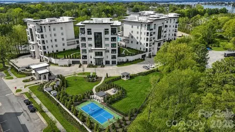 Aerial view of Watermark with pickleball court, fire pit area, and dog park.