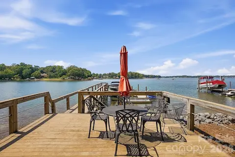 At the water’s edge, the private dock opens to expansive Lake Norman views and offers plenty of space for lounging, dining, and enjoying life on the water. The wide channel setting creates a beautiful backdrop for boating and entertaining.