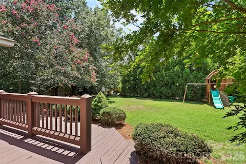 Back yard offers it all: play set, chicken coop, fire pit and large yard!