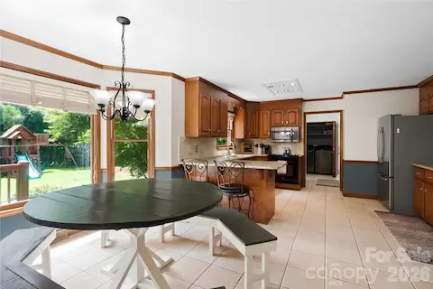 Custom, huge table as you enter the kitchen area (table conveys!)