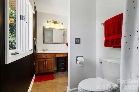 Full bath upstairs with extra counter space and tub/shower combo