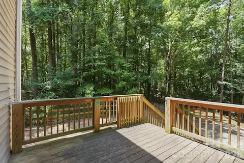 Back deck with wooded views. Deck has been powerwashed and restained.