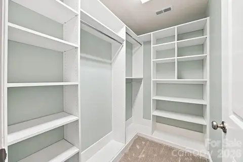 Primary Bedroom double closets with custom built ins
