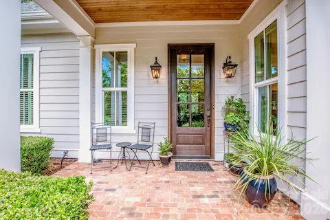 Welcome home to the covered front porch with a tongue and groove ceiling